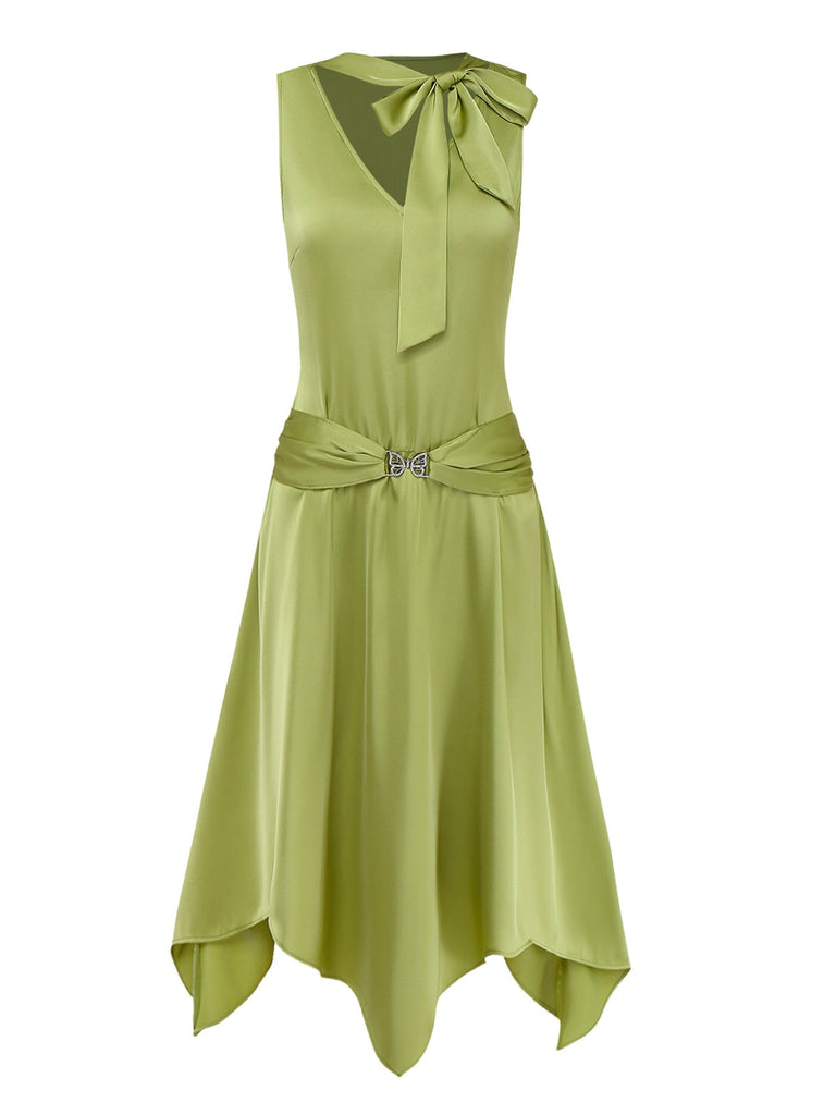 Green dress with a bow detail on a white background