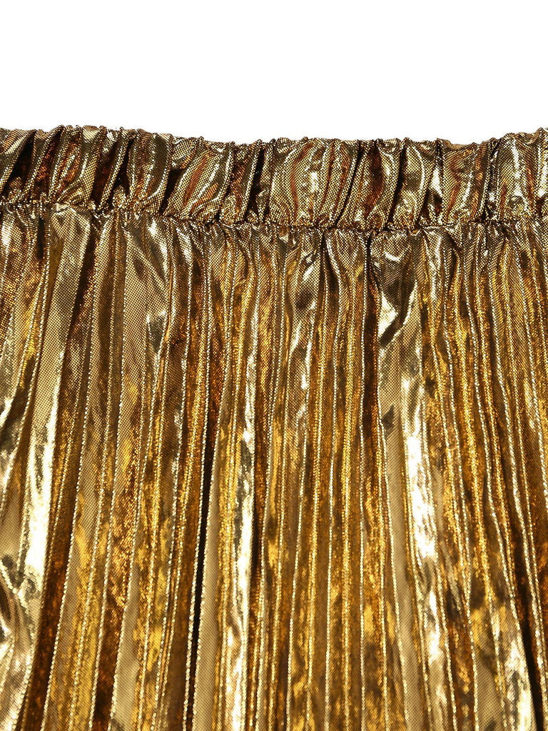 Close-up of a gold metallic pleated skirt on a white background