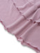 Close-up of pink ruffled fabric on a white background