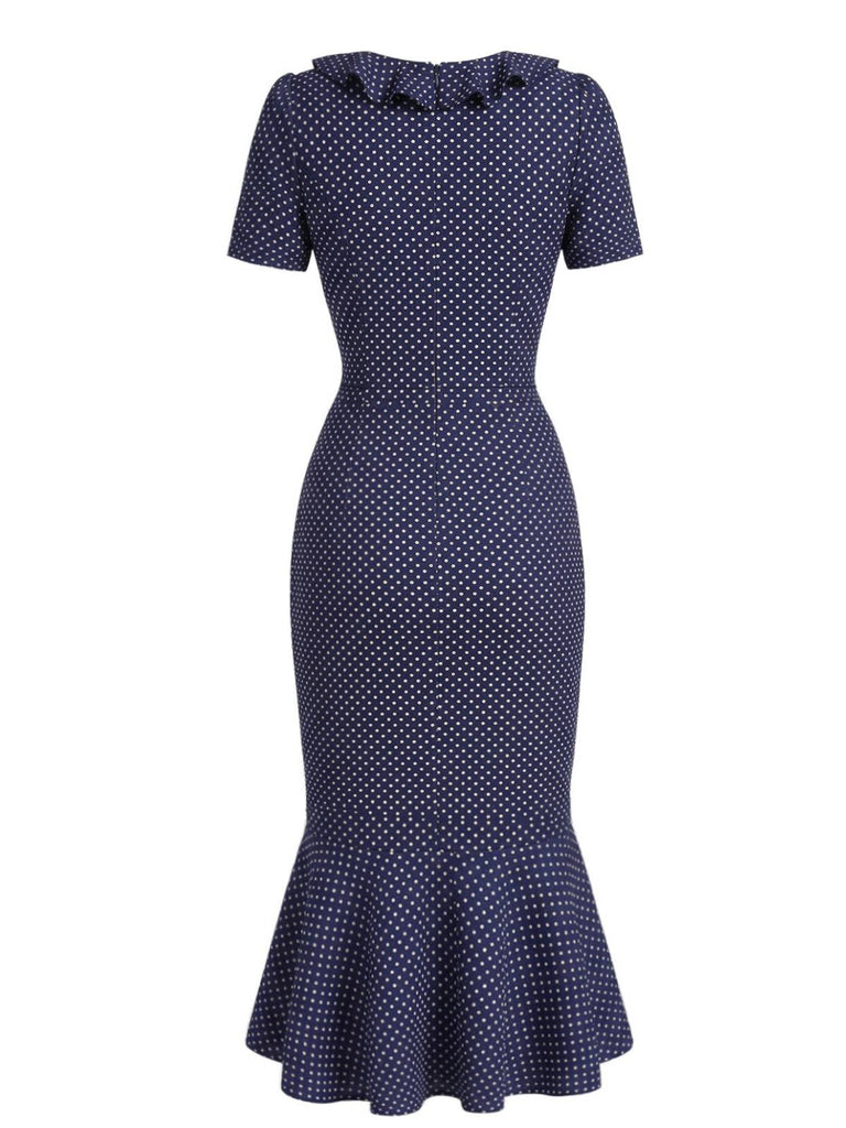 Navy blue dress with white polka dots on a white background
