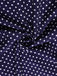 Navy blue fabric with white polka dots