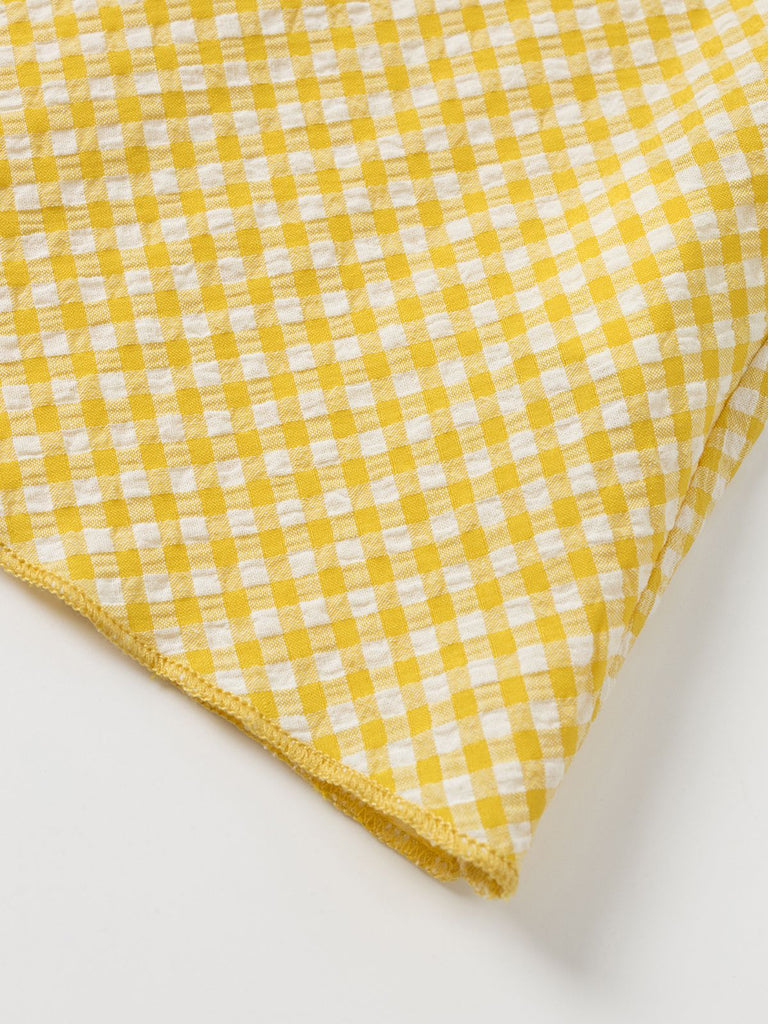 Robe à carreaux jaunes col v dos nu des années 1960