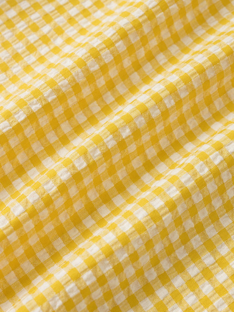 Robe à carreaux jaunes col v dos nu des années 1960