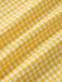 Robe à carreaux jaunes col v dos nu des années 1960