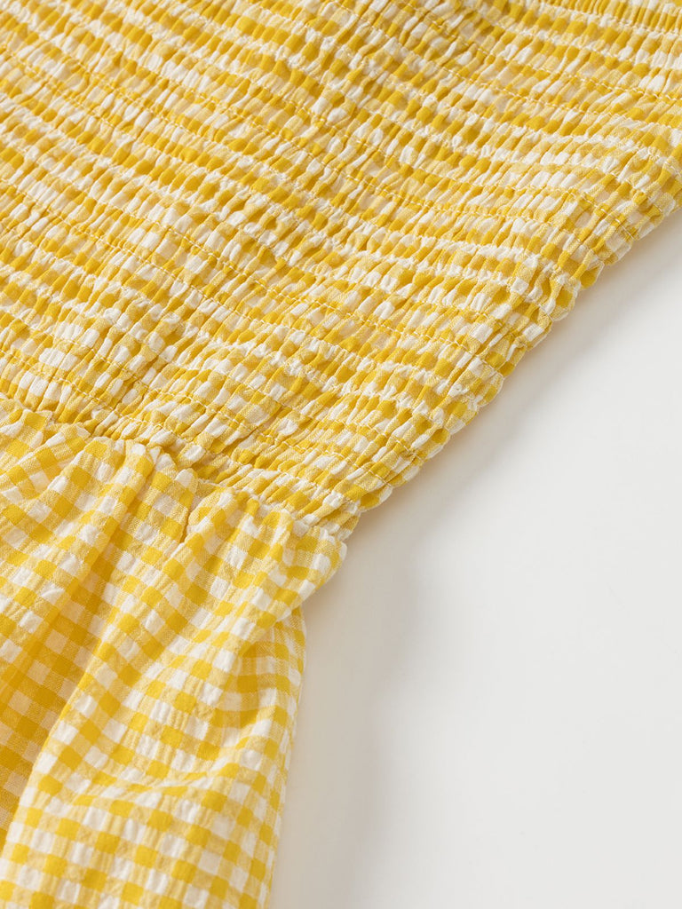 Robe à carreaux jaunes col v dos nu des années 1960