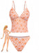 Maillot de bain tankini orange vintage des années 1970, avec un décolleté en V profond et un imprimé floral délicat, parfait pour les vacances à la plage et la détente au bord de la piscine.