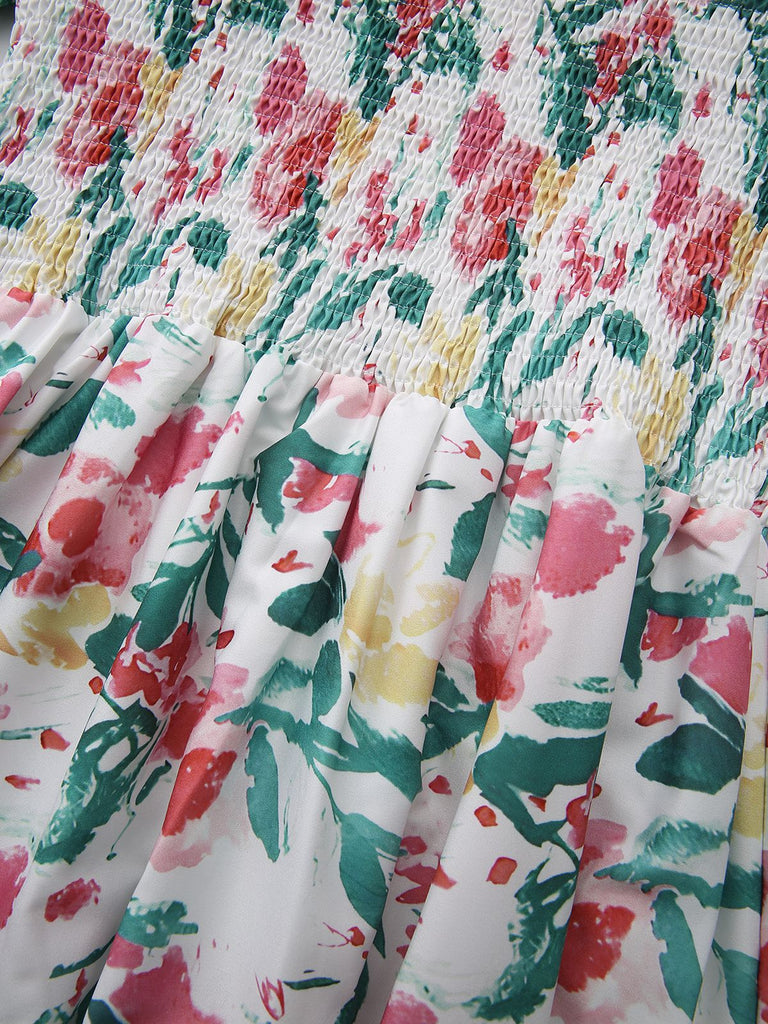 Floral patterned fabric with red, green, and yellow colors on a white background