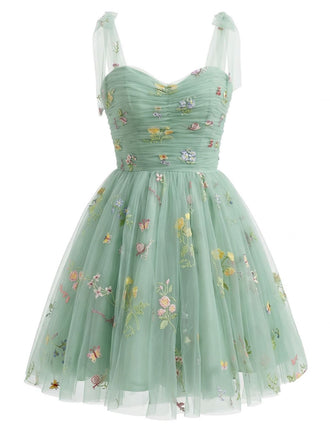 Green floral dress with sheer straps on a white background