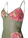 Floral patterned slip dress with green straps on a white background