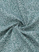 Close-up of green fabric with white floral pattern