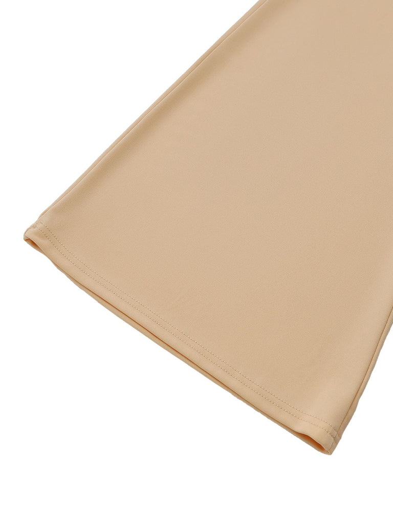 Combinaison beige à dos nu froncé et ornée perles jambes larges années 60