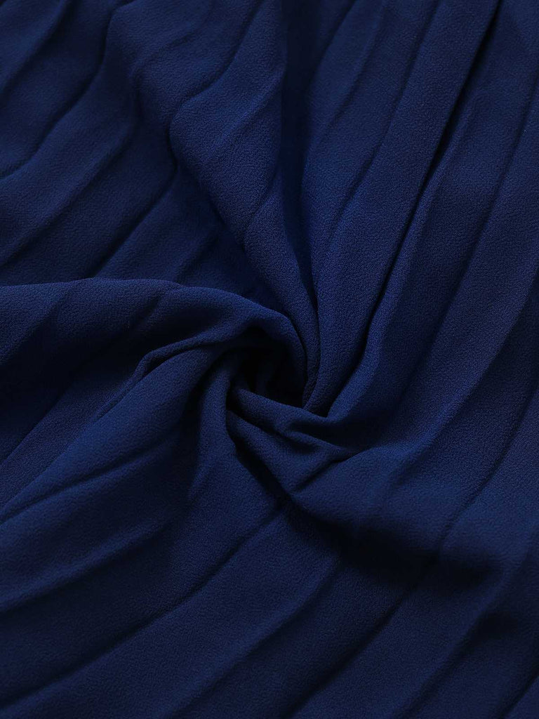 Robe plissée sans manches à boutons nacrés et ceinture années 1960