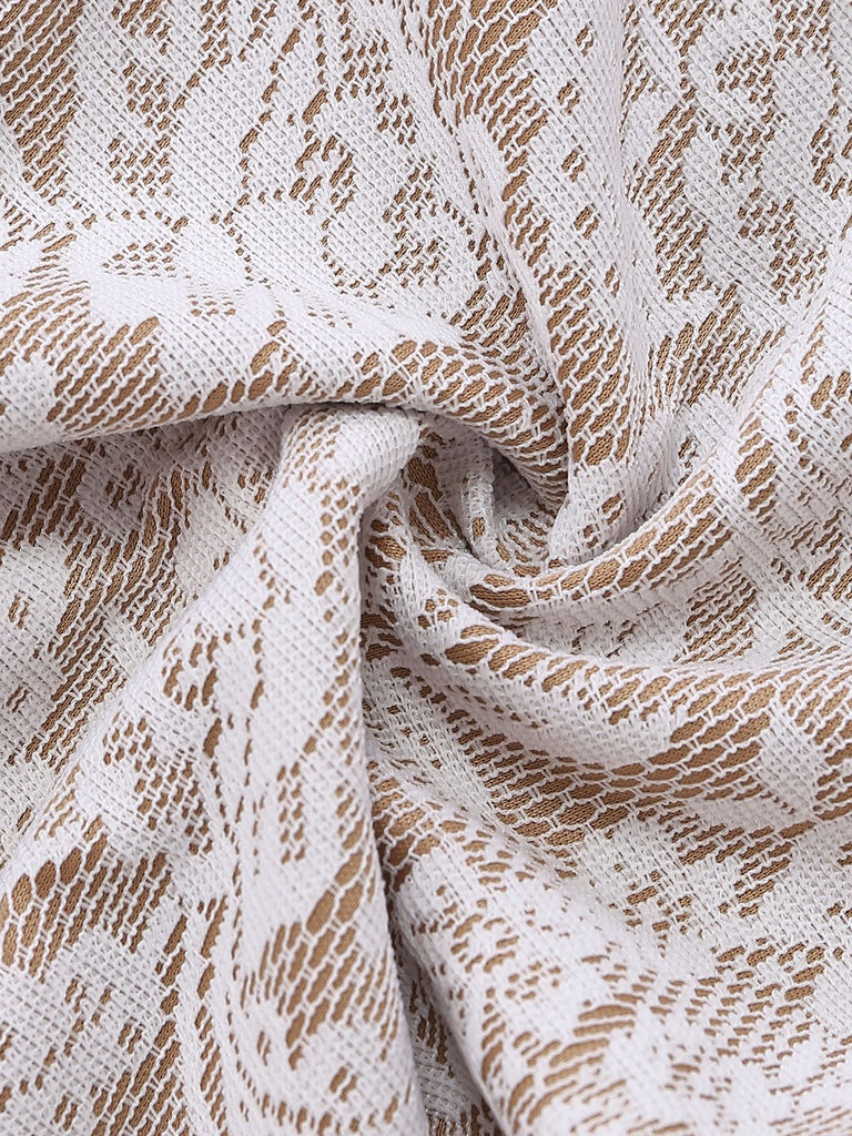 Combinaison blanche en dentelle manches longues jambes évasées 1970s