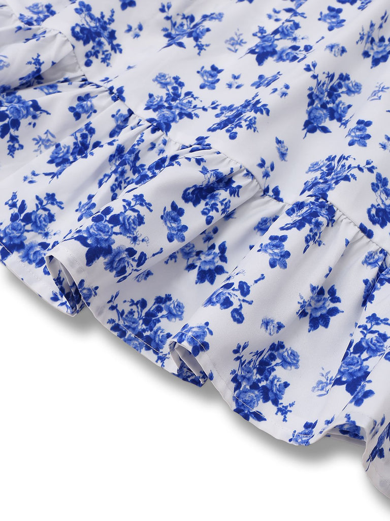 Robe bleue à bretelles fines et fleurs des années 1950