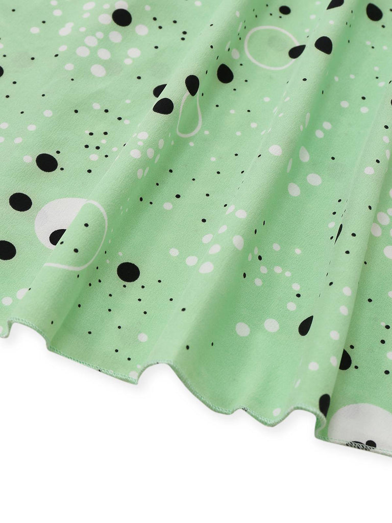Robe à pois irréguliers à volants et col en V années 1940