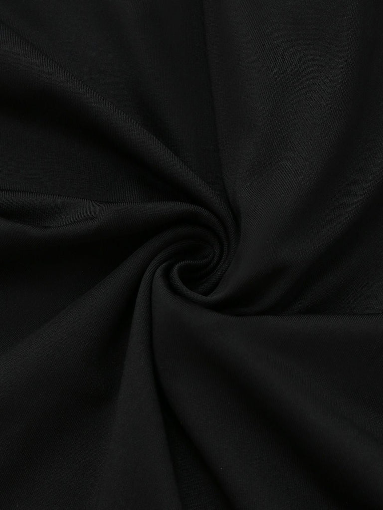 Robe péplum à volants noire et blanche années 1960