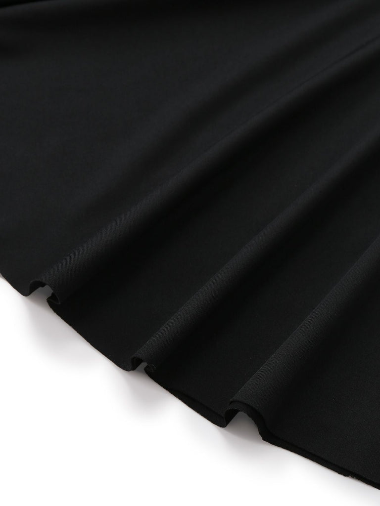 Robe péplum à volants noire et blanche années 1960