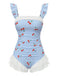 Maillot de bain une pièce bleu vintage à carreaux cerises et superposition de tulle à volants romantique, parfait pour un look de plage inspiré des pin-up des années 50