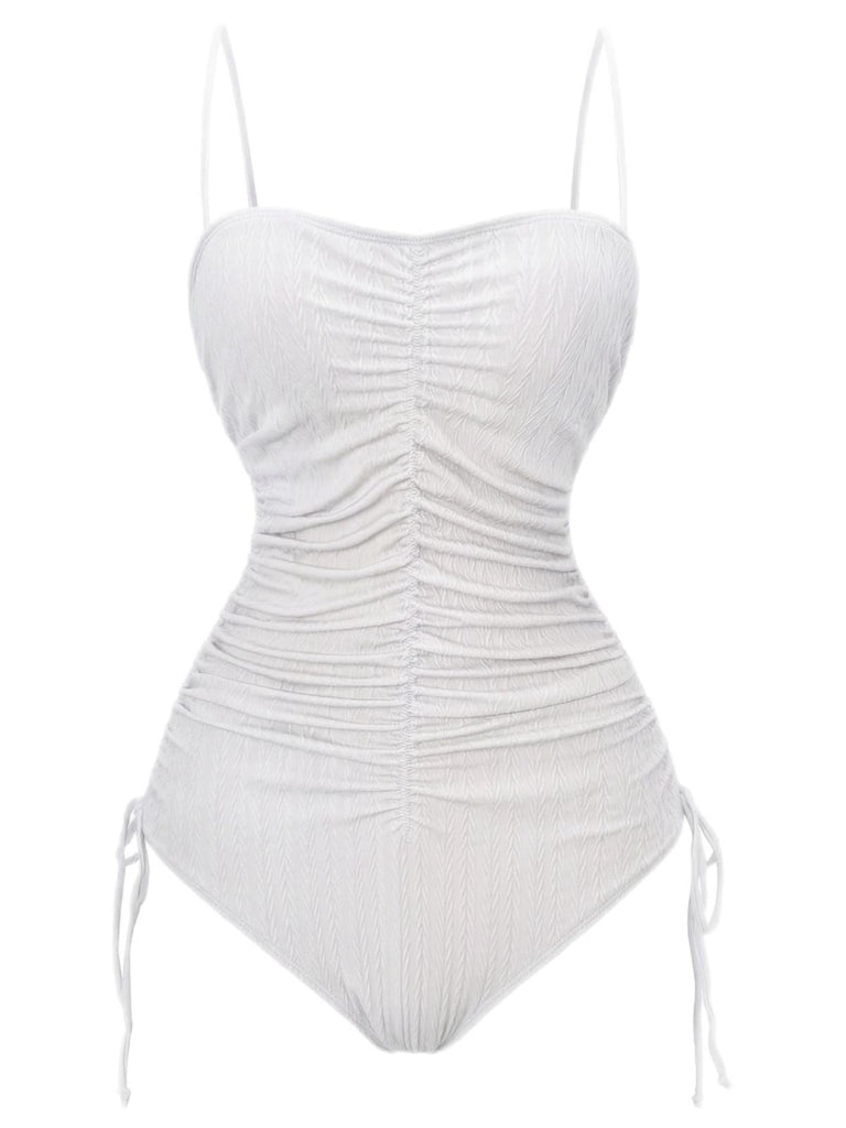 Red swimsuit with ruched design on a white background
