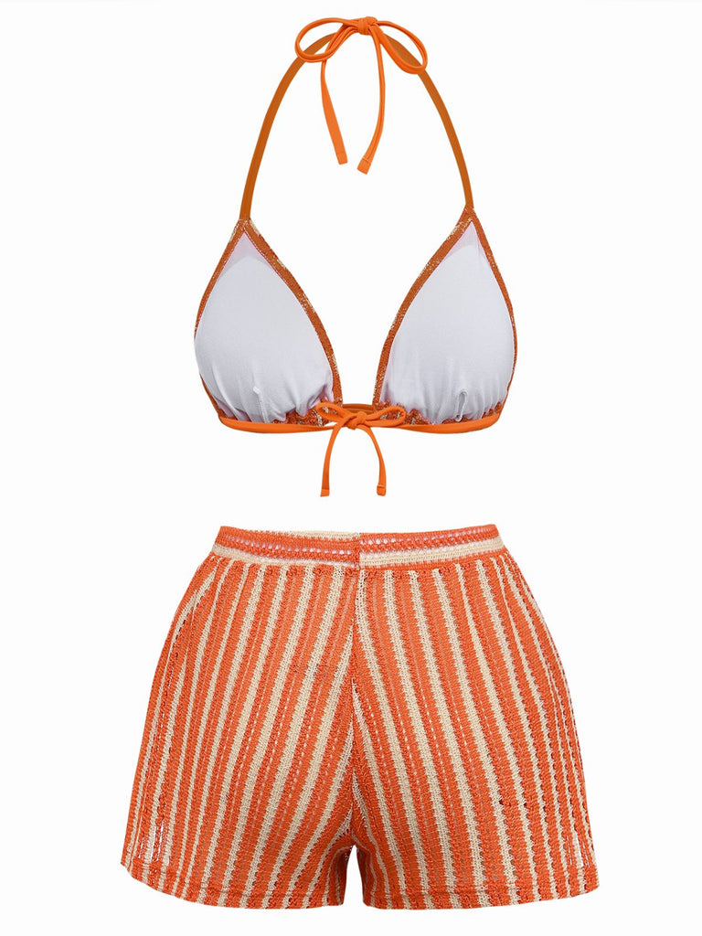 Orange and white bikini set on a white background