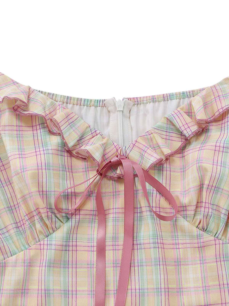 Pastel plaid swing dress with ruffled bow details and sweetheart neckline for 1950s vintage styling