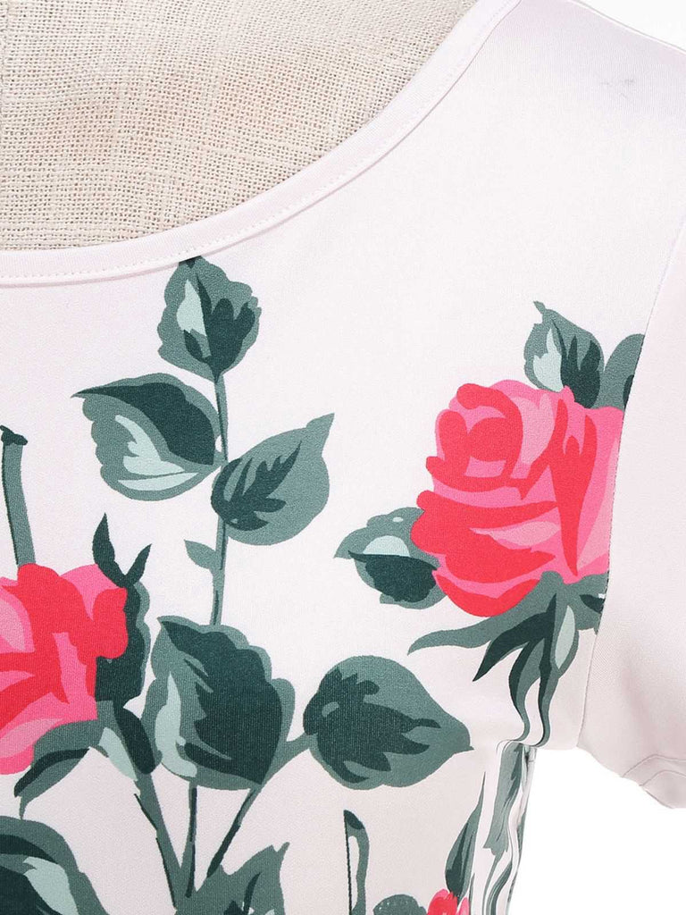 Floral pattern with pink roses and green leaves on a white background