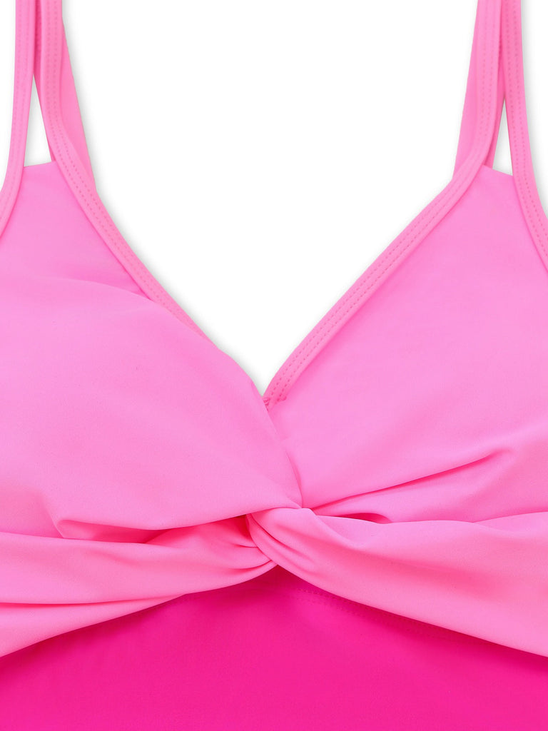 Close-up of a pink bikini top with a white background