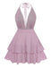 Pink halter neck dress with ruffled layers on a white background