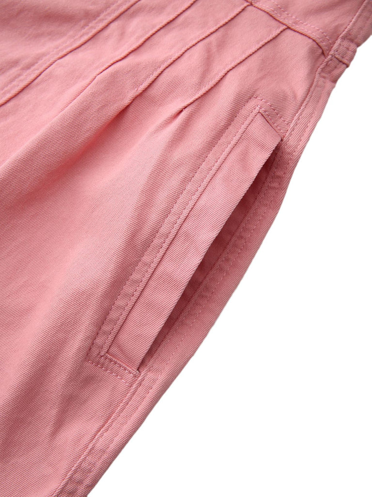 Close-up of pink shorts with a pocket on a white background