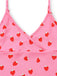 Pink top with red strawberry pattern on a white background