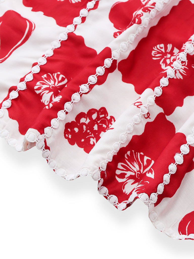 Red and white floral fabric with lace trim on a white background