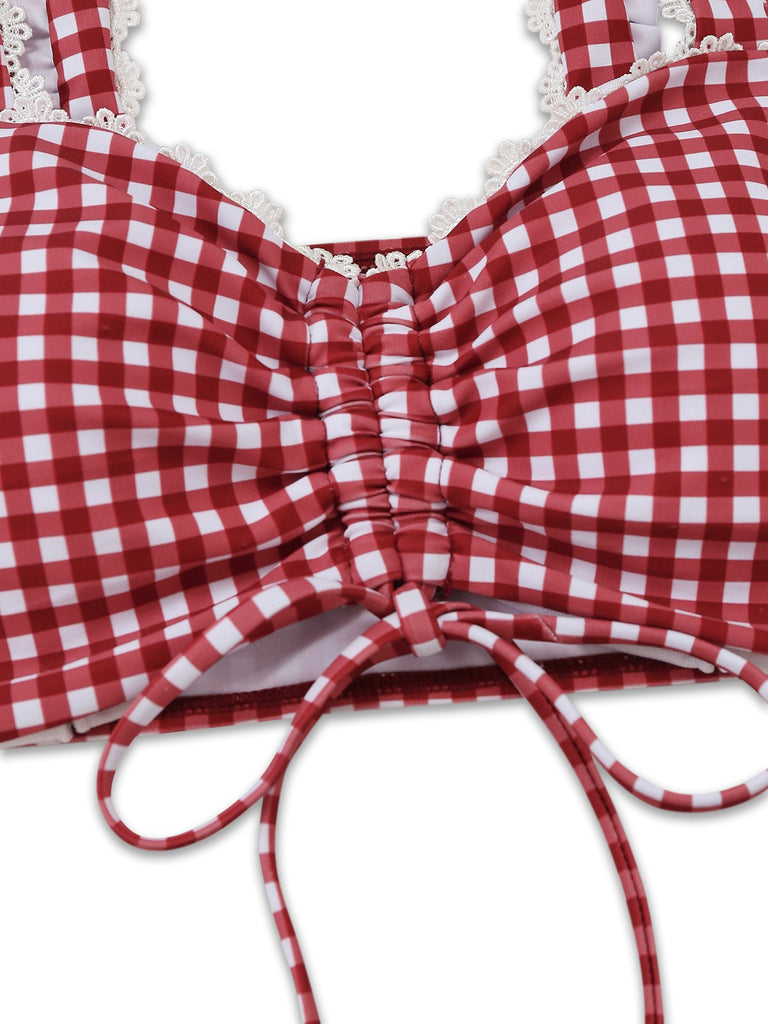 Red and white checkered bikini top with lace trim on a white background