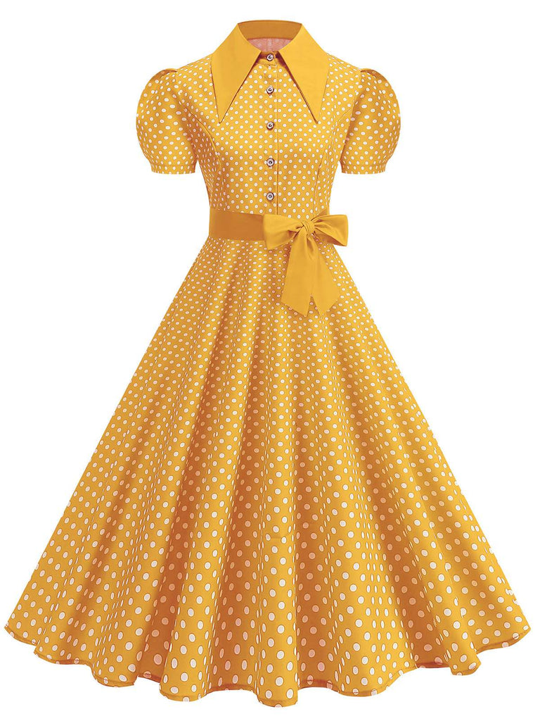 Robe trapèze vintage à pois, ceinturée et à col chemise, dans un style rétro classique des années 1950.