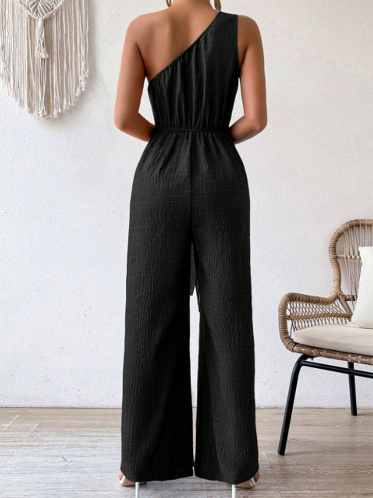 Combinaison asymétrique noire unie col oblique années 1970