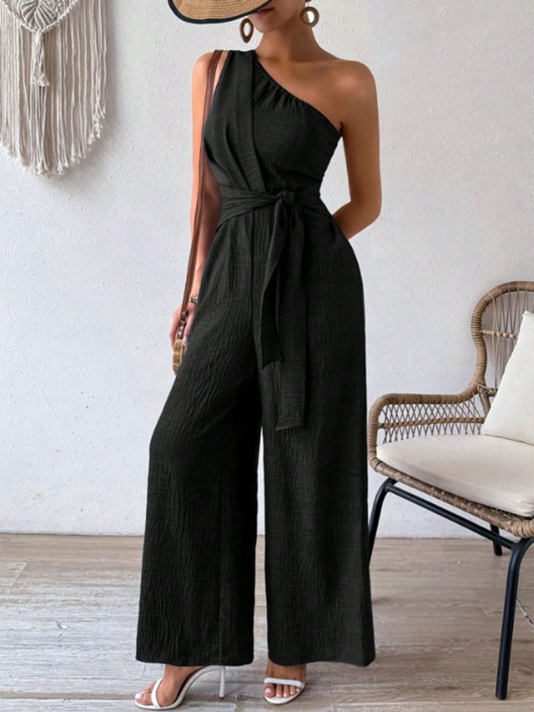 Combinaison asymétrique noire unie col oblique années 1970