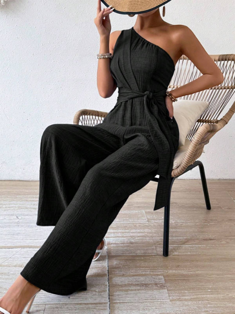 Combinaison asymétrique noire unie col oblique années 1970