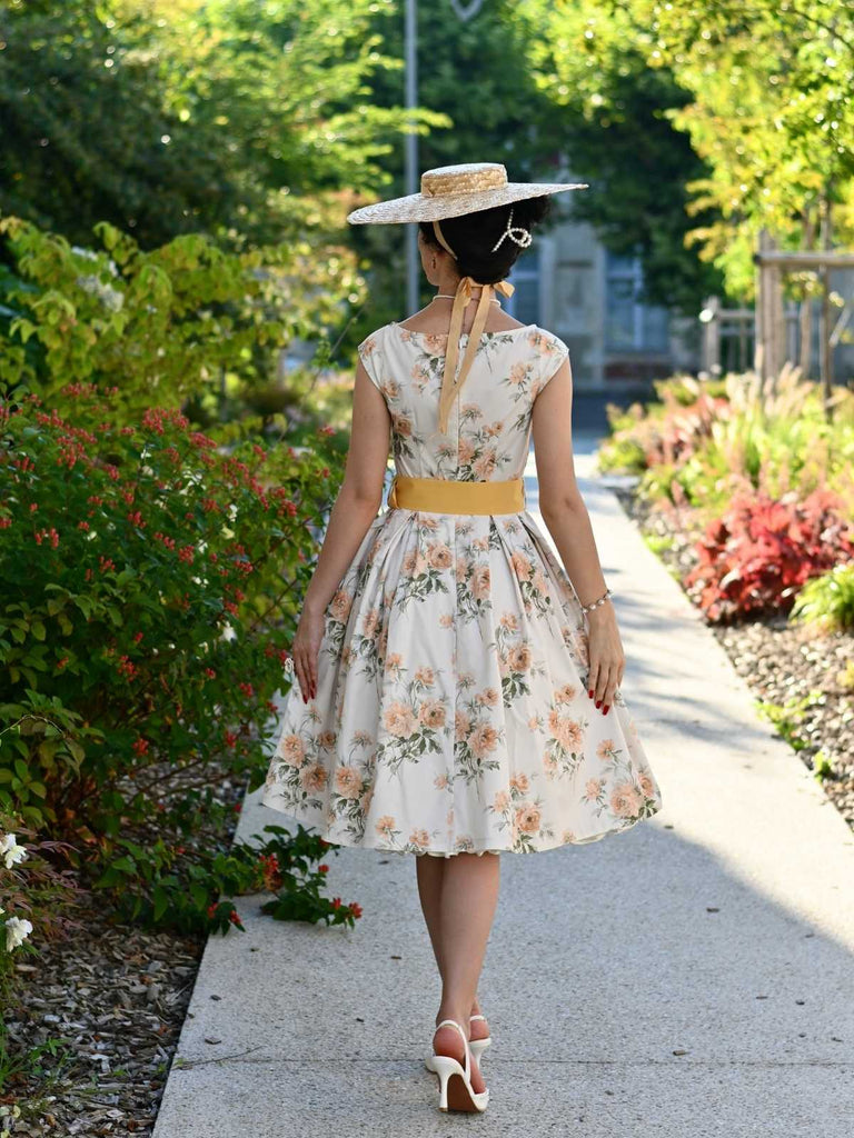 Robe jaune à fleurs antique col bateau ceinturée années 1950