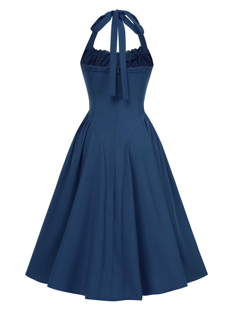 Robe dos nu à lacets et taille basque unie des années 1950