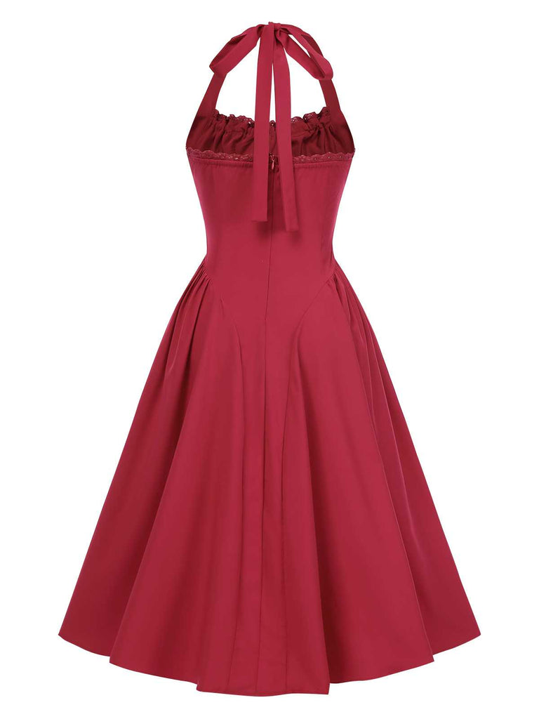 Robe dos nu à lacets et taille basque unie des années 1950