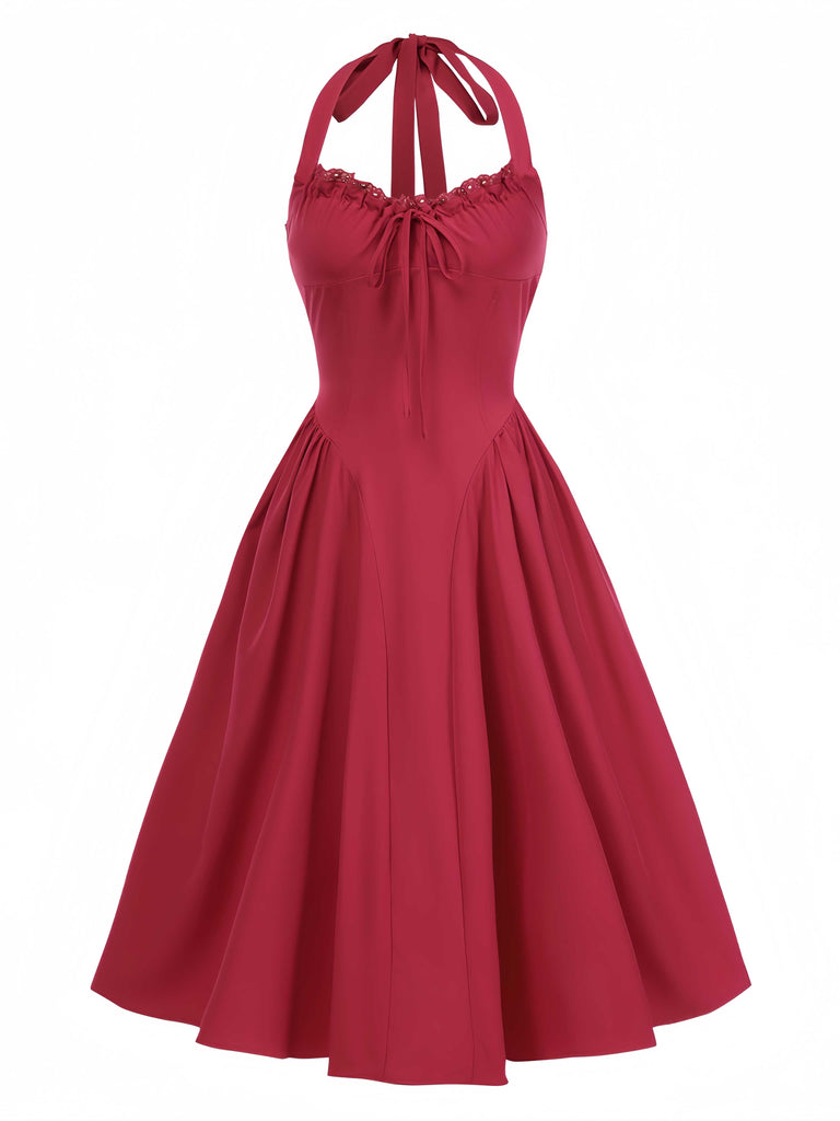Robe dos nu à lacets et taille basque unie des années 1950