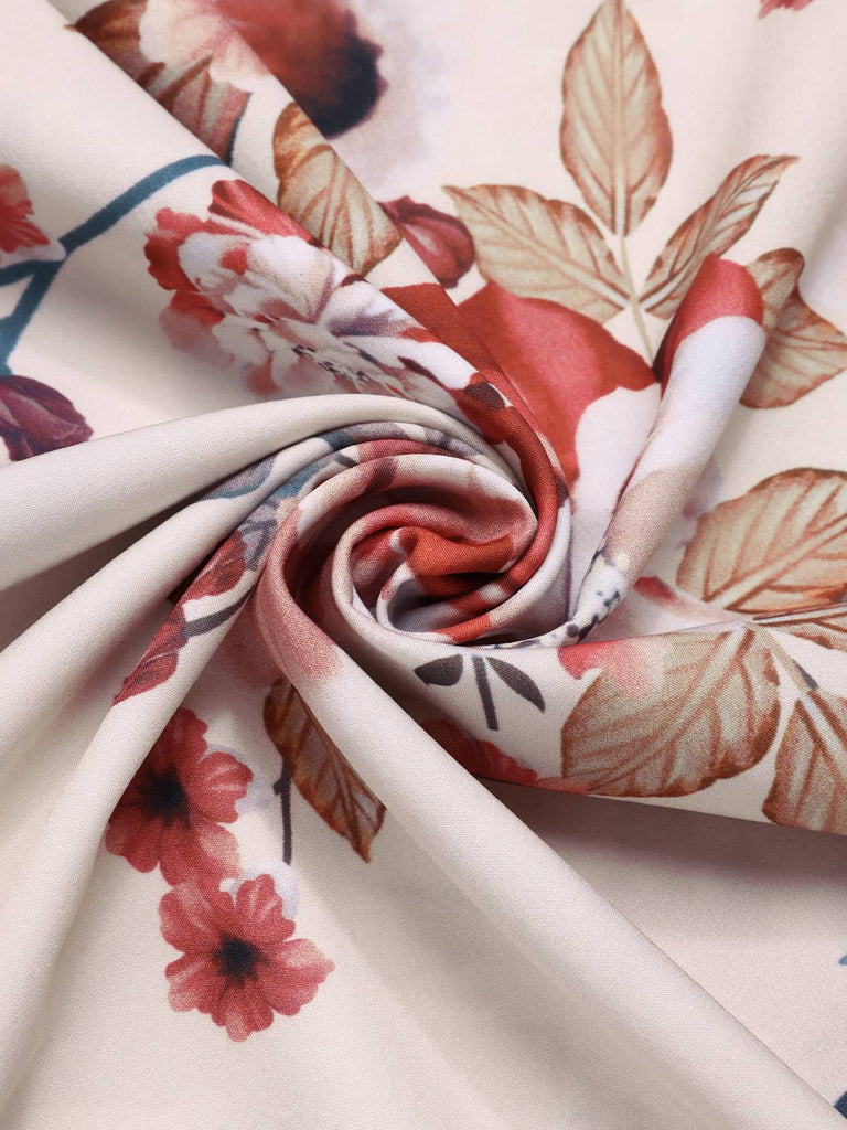 Robe  revers ceinturée à fleurs abricot des années 1940