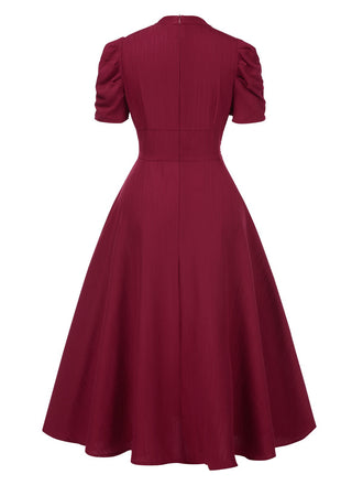 Robe manches bouffantes à col en V unie années 1950