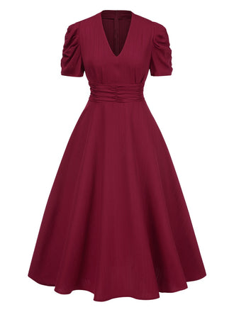 Robe manches bouffantes à col en V unie années 1950