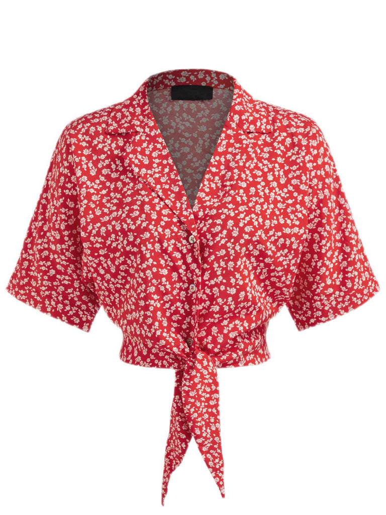 Chemisier rouge à fleurs à revers avec nœud des années 1950