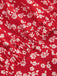 Chemisier rouge à fleurs à revers avec nœud des années 1950
