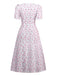 Robe lavande col V manches bouffantes à petites fleurs des années 1940