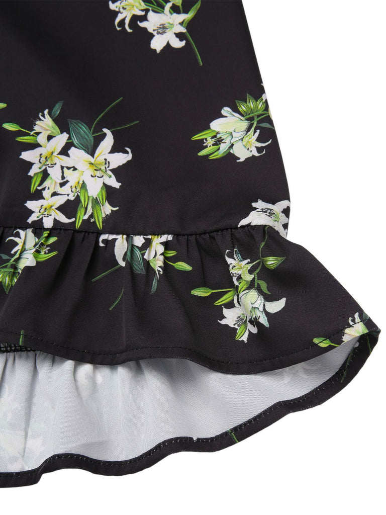 [Prévente] Robe noire à volants et col en V imprimé lys des années 1950