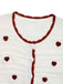 Cardigan tricoté blanc contrasté à cœurs années 1950