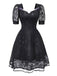 Robe noire brodée en dentelle style sorcière gothique des années 1950