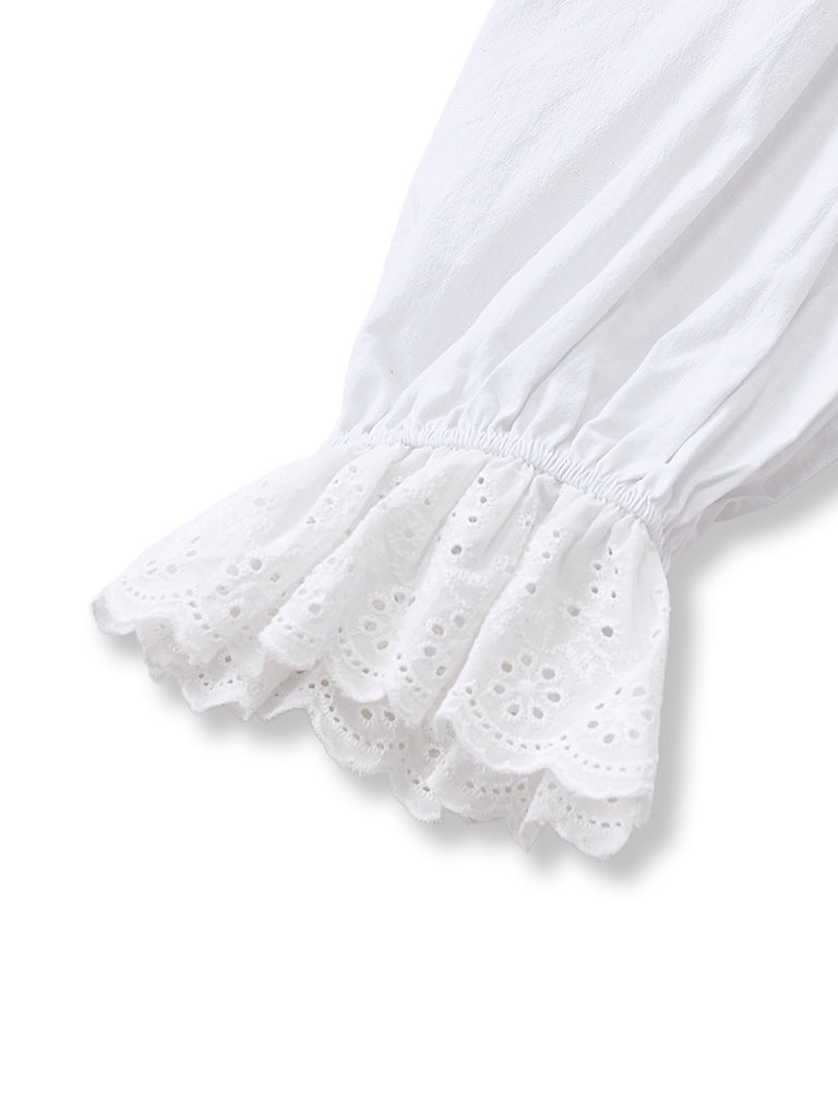 Chemisier blanche à manches bouffantes et nœud années 1960